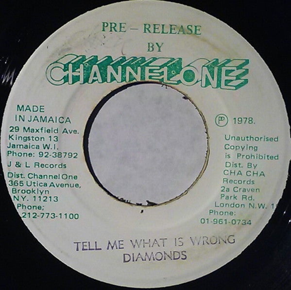 Diamonds* : Tell Me What Is Wrong (7", Gre)